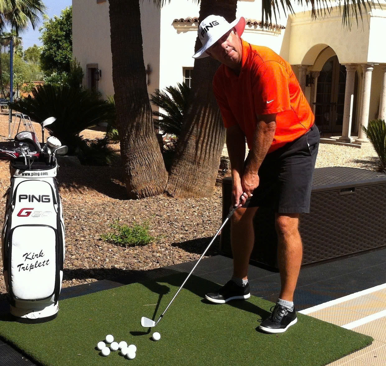 a golfer practicing swing