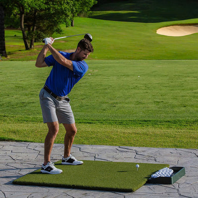 A golfer practicing golf swing on a golf course